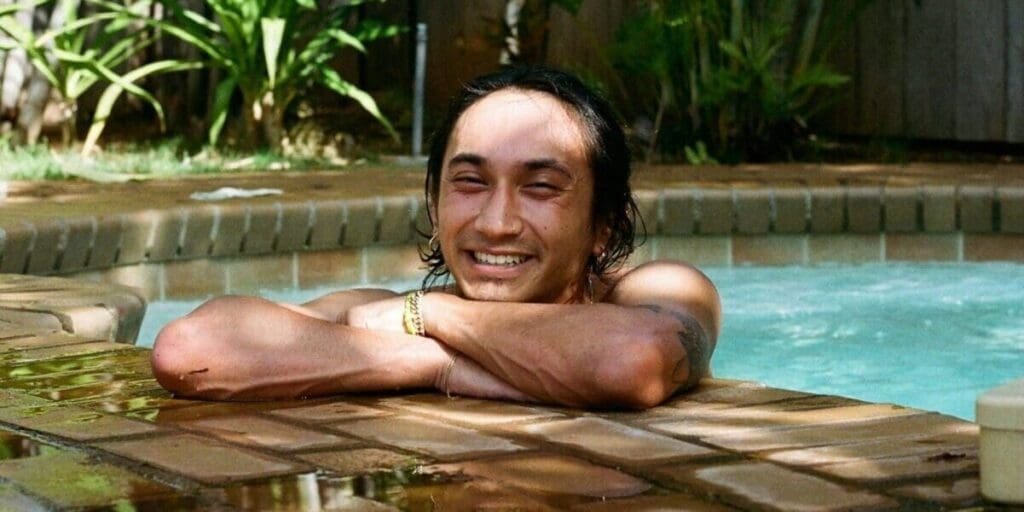 Man Resting at Edge of Hot Tub Pool Relaxing in the Water