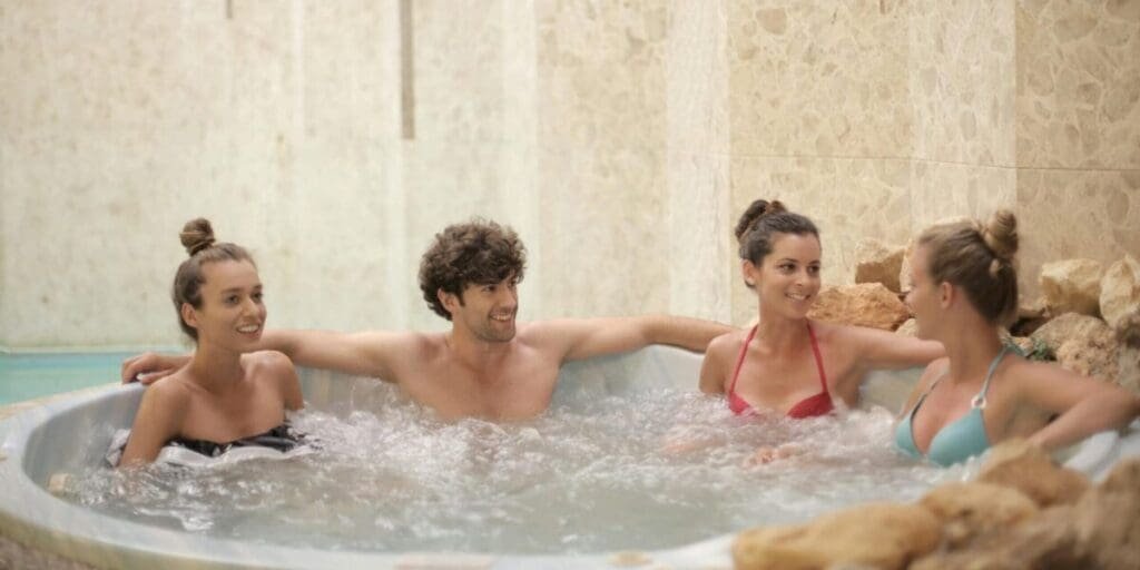 Group Of People Relaxing in a Hot Tub - Relax & Recharge With Friends