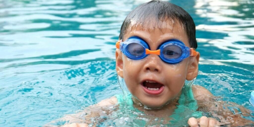 Toddler Swimming in Pool - Pool Maintenance & Cleaning is Important